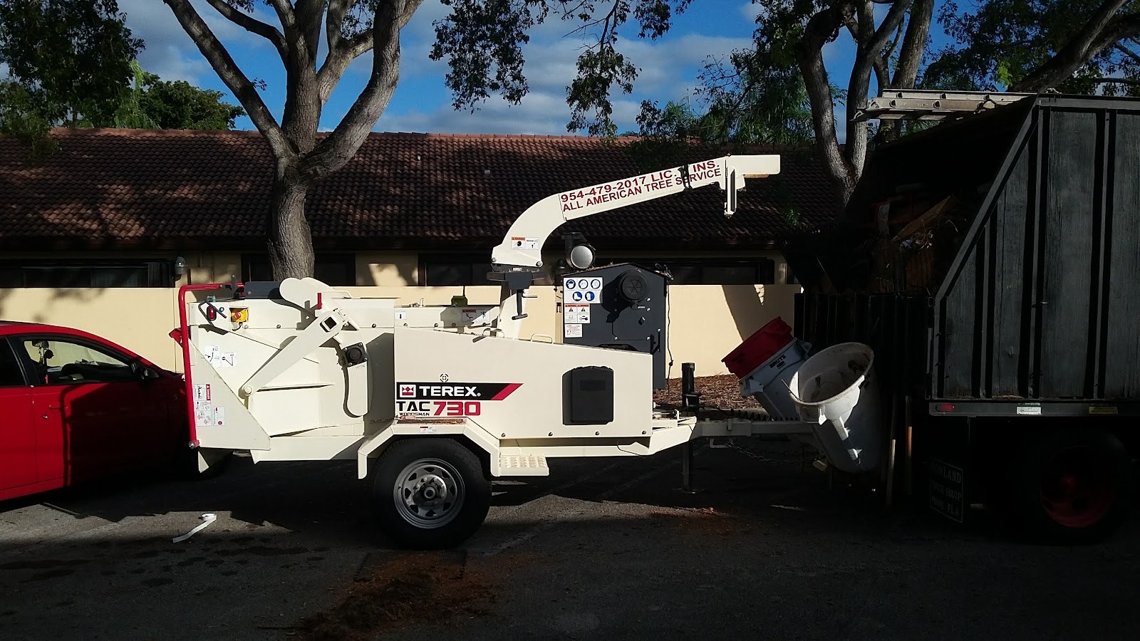 Chipper truck and trailer on site